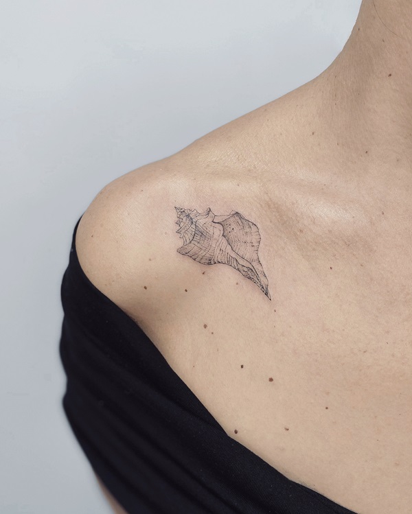 Conch shell clavicle tattoo