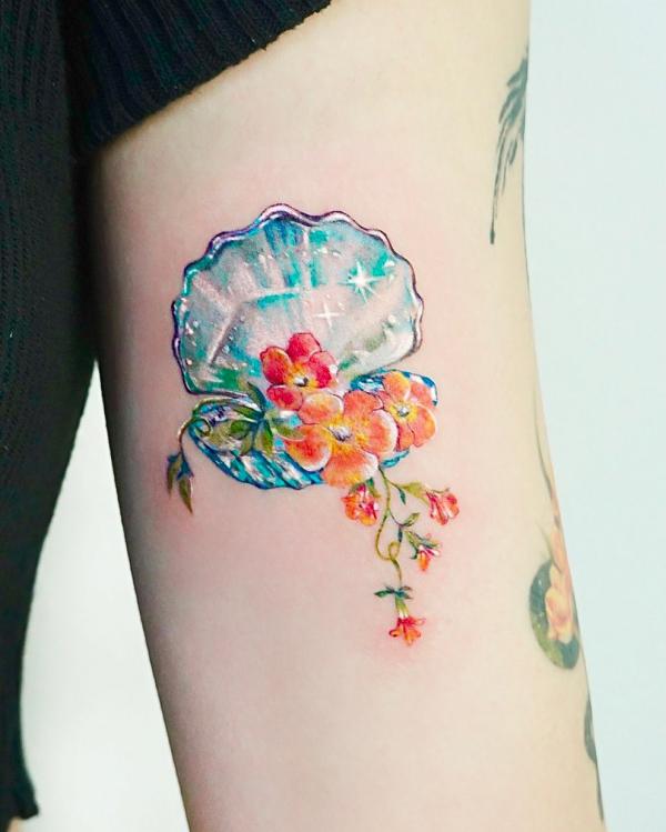 Crystal shell with flower tattoo