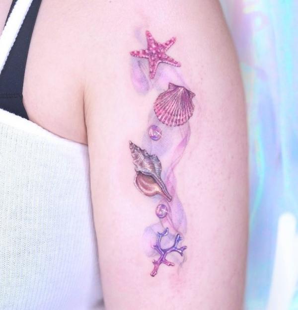 Feminine Scallop conch shells with starfish and pearls tattoo