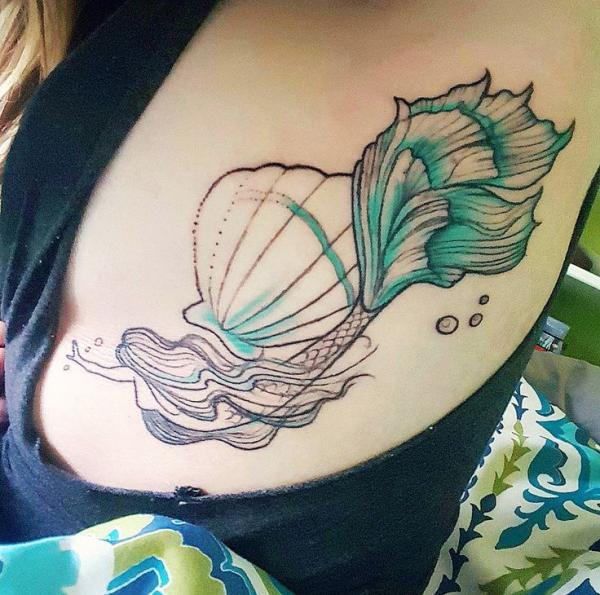 Mermaid shell rib cage tattoo