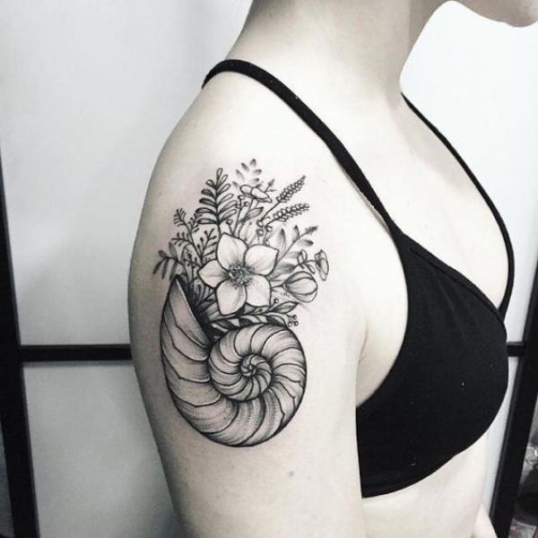 Nautilus shell with flower and leaves quarter sleeve tattoo