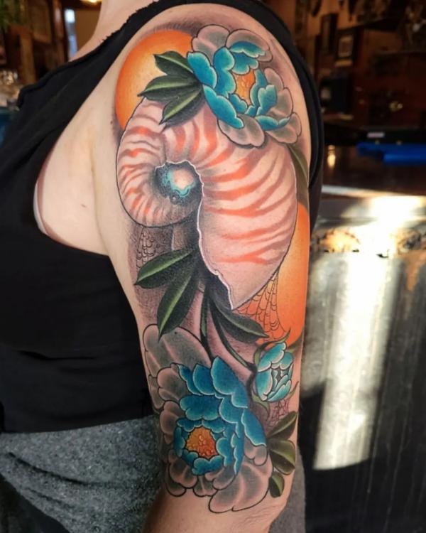 Nautilus shell with peony flowers half sleeve tattoo