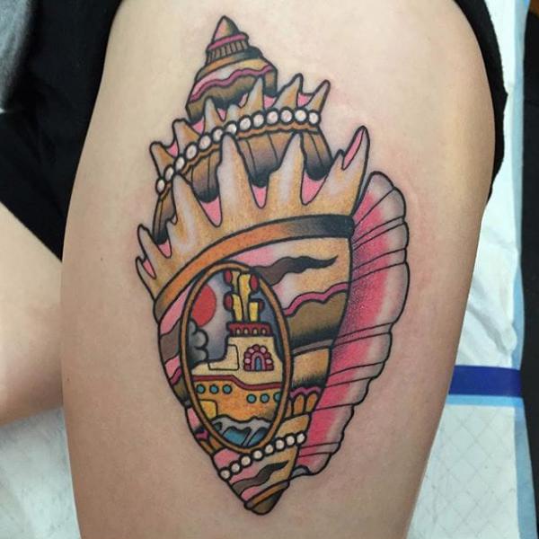 Neo traditional conch shell thigh tattoo