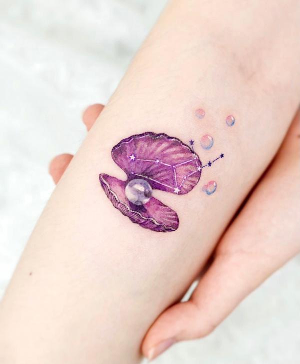Purple shell with pearls and virgo constellation tattoo