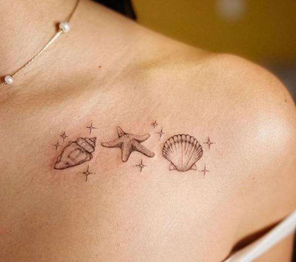Scallop conch shells with starfish clavicle tattoo