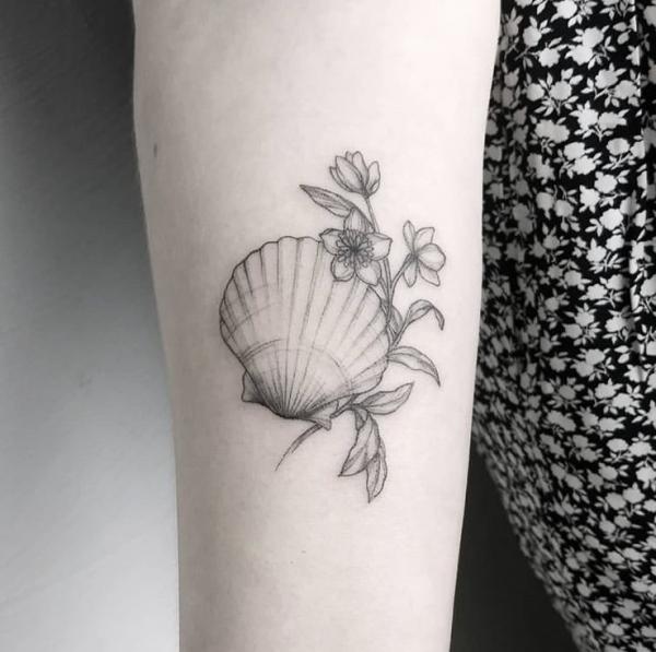 Scallop shell with flowers tattoo black and grey
