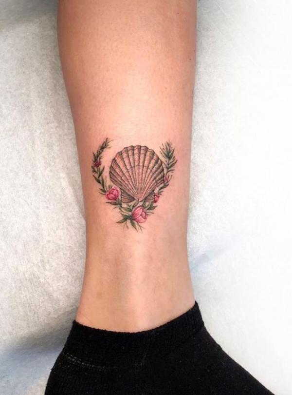 Shell with open floral wreath tattoo