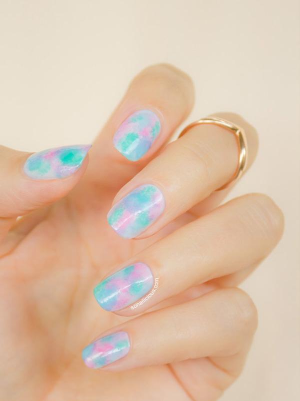 Light pink and blue abstract painting nail art