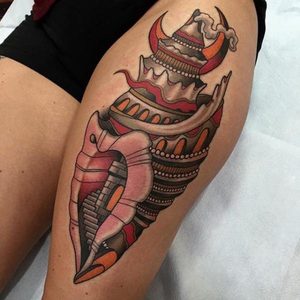 Traditional conch shell thigh tattoo