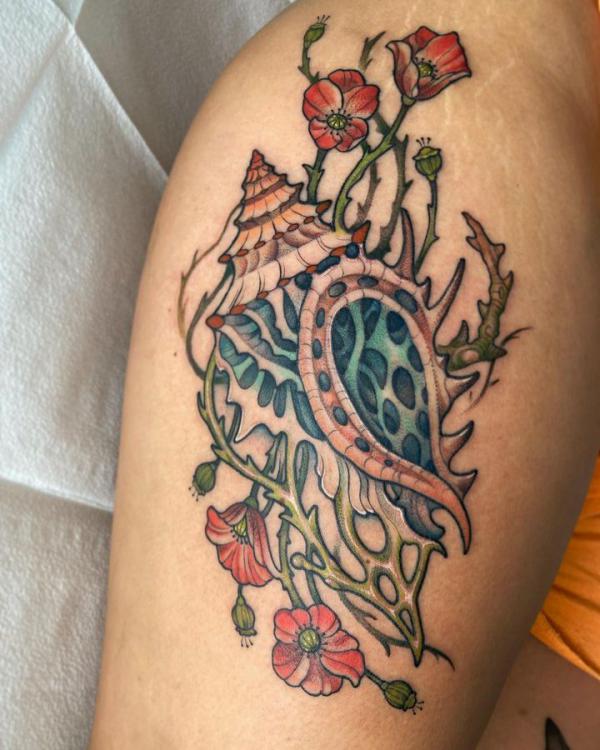 abstract seashell and poppy tattoo