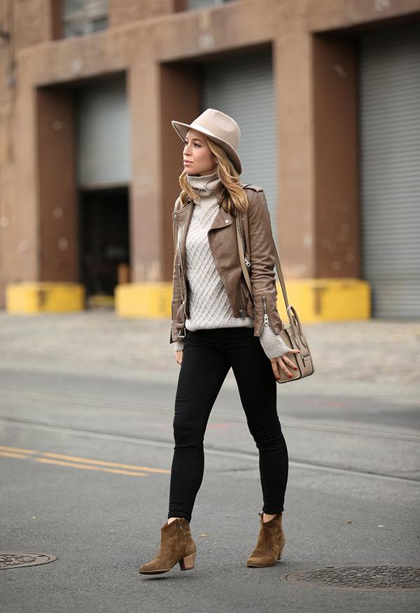 Helena Glazer looks ultra cool in a pair of suede boots, skinny jeans, and an authentic tan leather jacket.