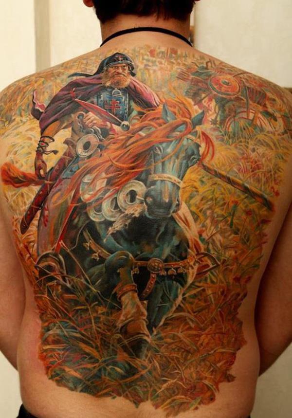 colored warrior with horse full back tattoo