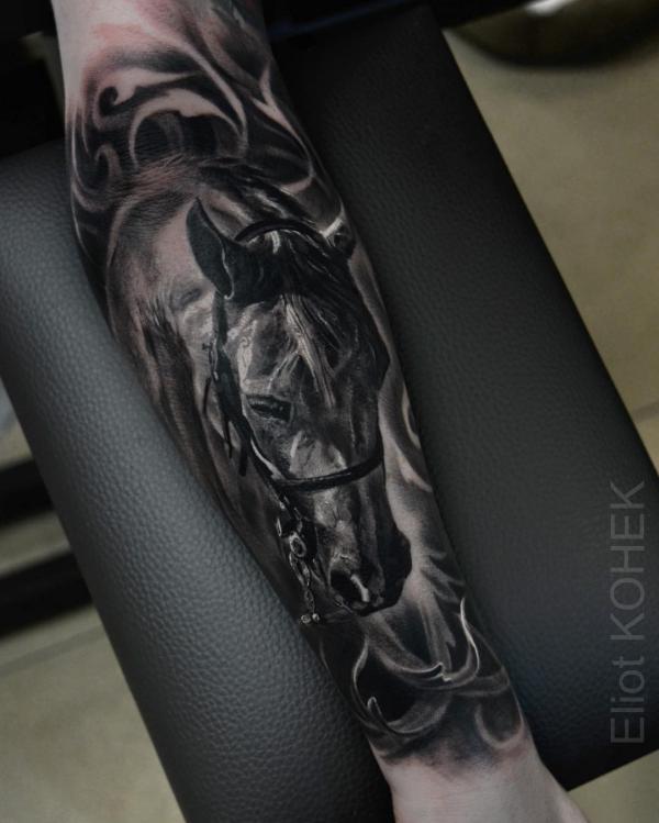 Blackwork horse forearm tattoo