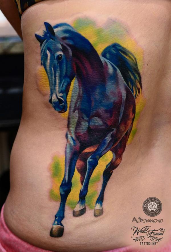 Blue and bay red horse tattoo on one side of back