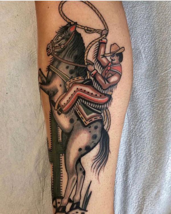 Cowboy riding a horse tattoo