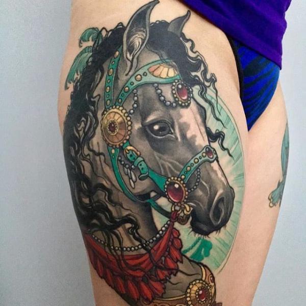 Decorative carousel horse thigh tattoo