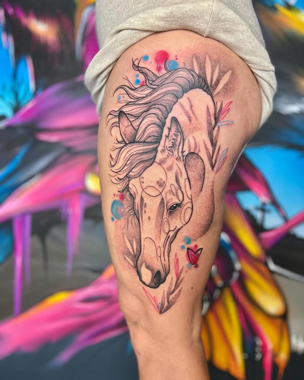 Feminine horse thigh tattoo