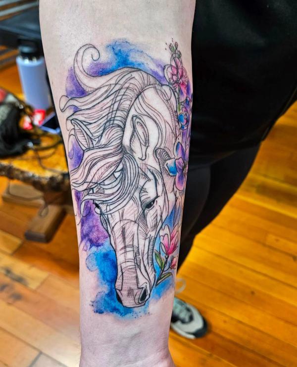 Fine line horse head on watercolor backdrop tattoo