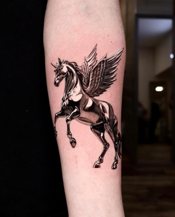 Golden horse with wings tattoo