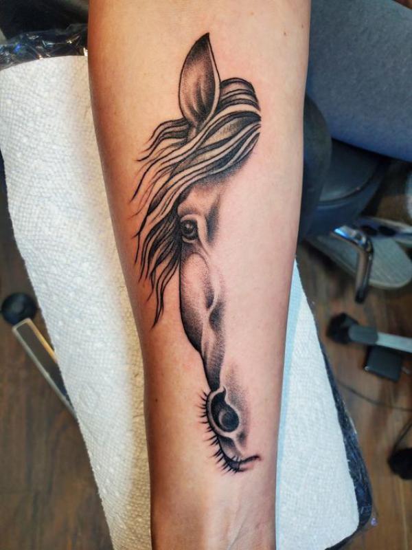 Half horse face tattoo