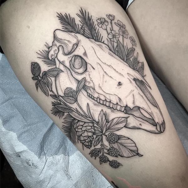Horse skull thigh tattoo