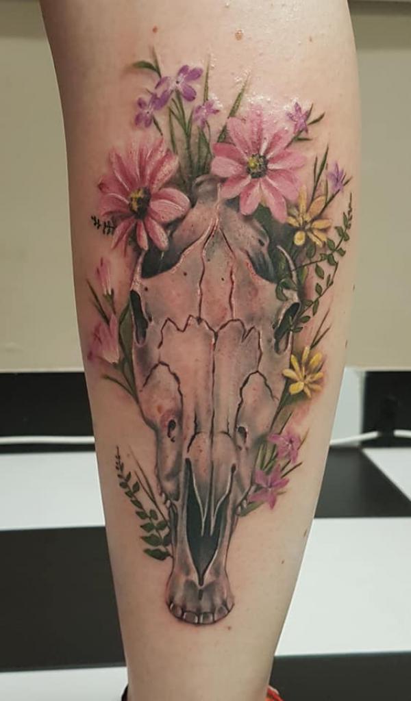 Horse skull with flowers calf tattoo