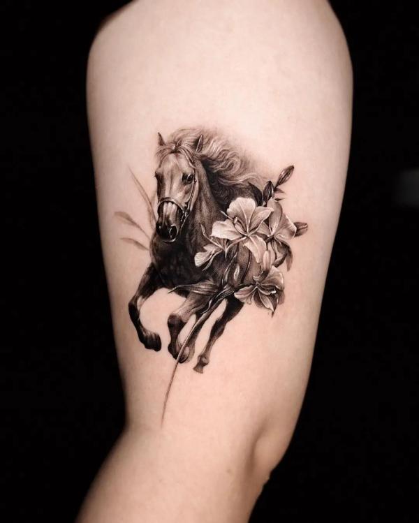 Horse with lily flower tattoo