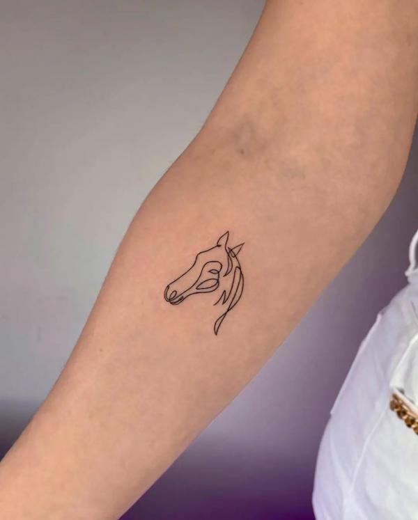 Minimalist horse outline tattoo