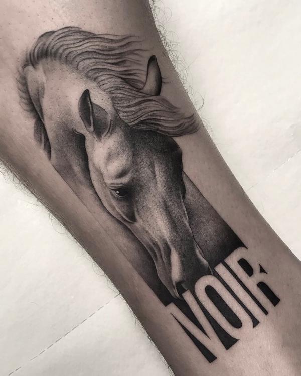 Realistic horse with initials tattoo
