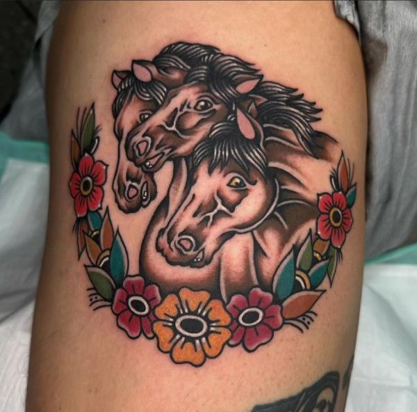 Three horses with flower wreath tattoo