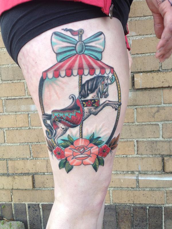 Traditional carousel horse thigh tattoo