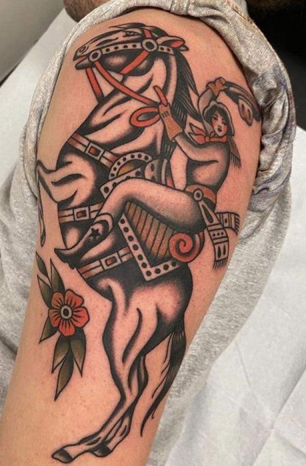 Traditional lady riding a horse tattoo