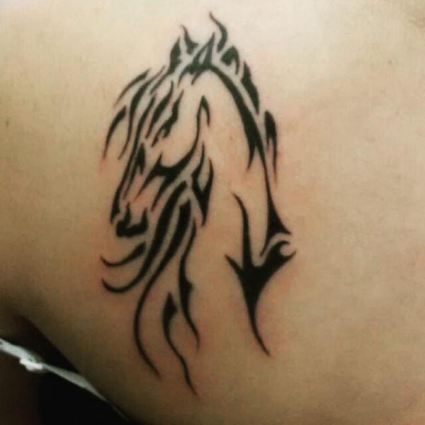 Tribal horse head tattoo
