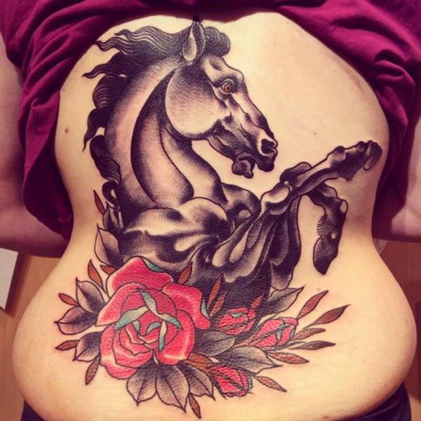 horse and rose low back tattoo