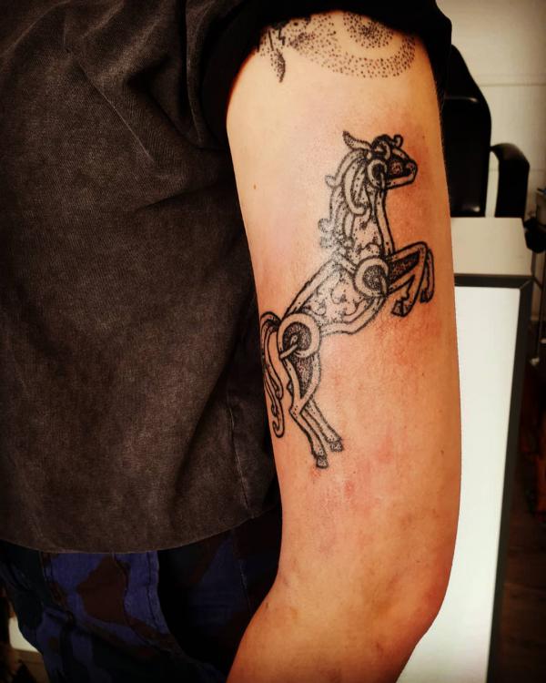 viking horse upper arm tattoo