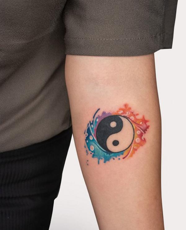 Yin yang forearm tattoo