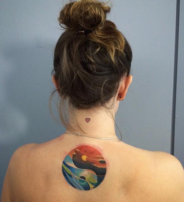 colorful Sunset and ocean yin yang back tattoo
