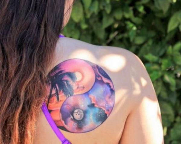 Beautiful Yin Yang tattoo depicting the sun and moon