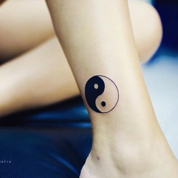 Classic Yin Yang tattoo above ankle