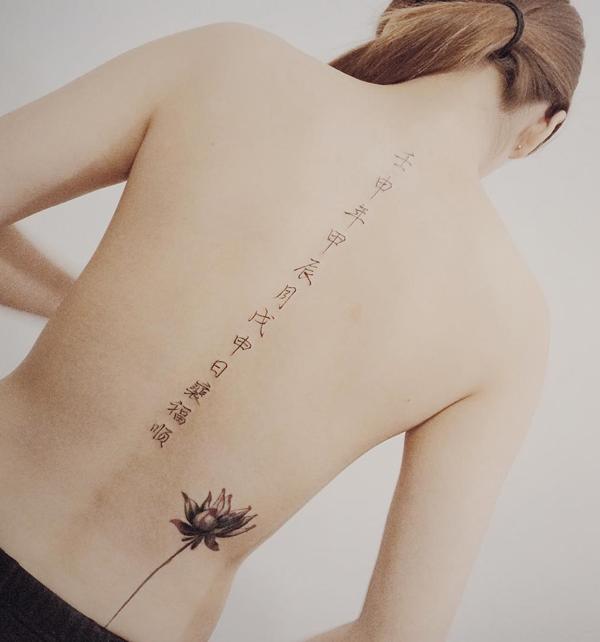 Fonts and lotus spine tattoo 22