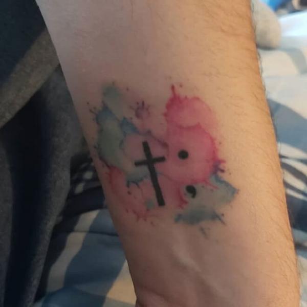 Cross and semicolon tattoo