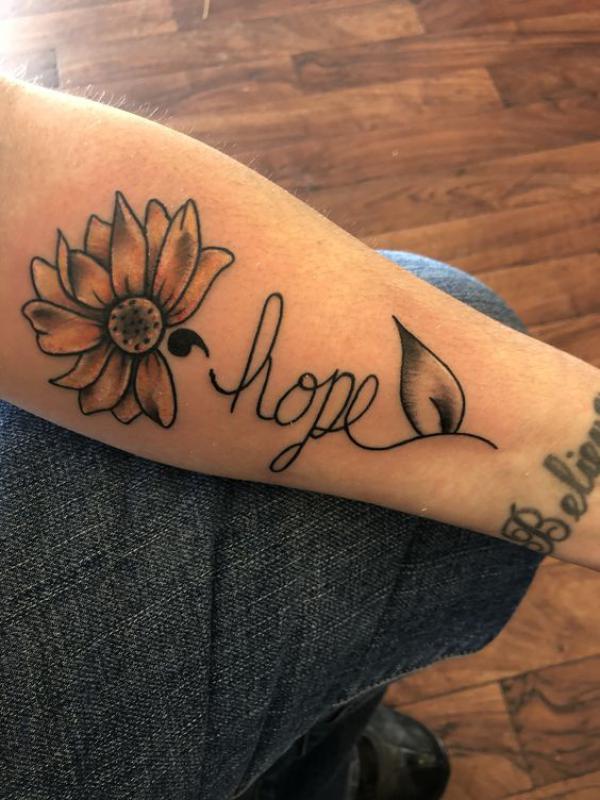 Hidden semicolon tattoo in the flower