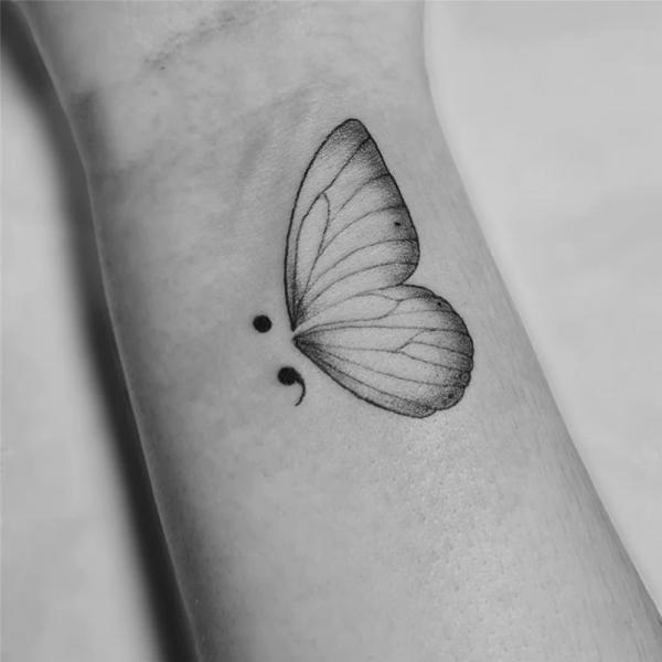 Moth semicolon tattoo