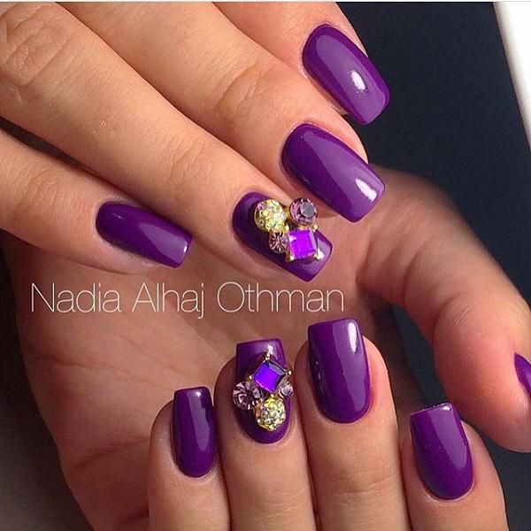 Premium Photo | Purple nail art with a black and purple design