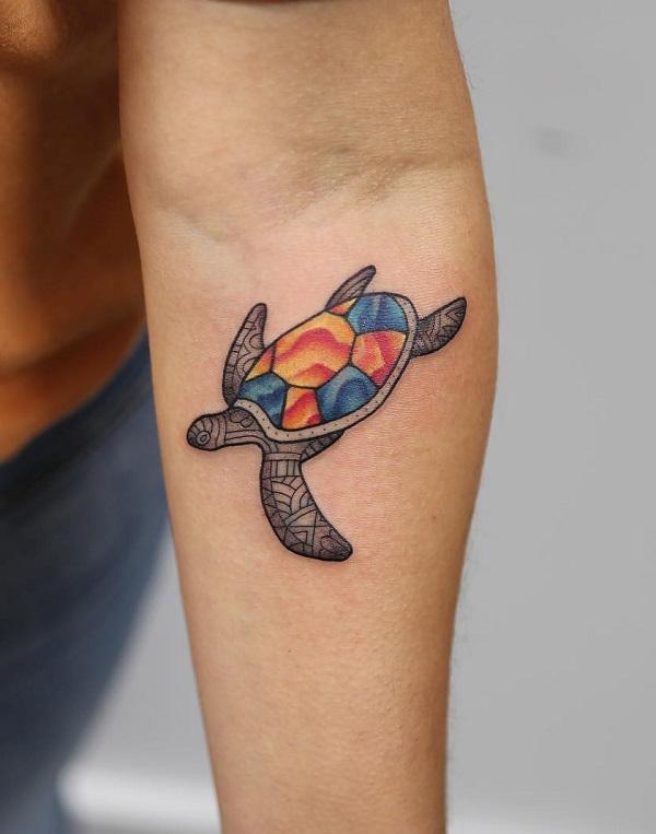 Sea turtle below inner elbow tattoo