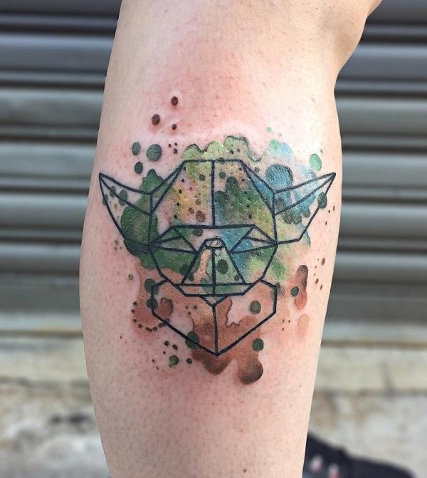 Origami turtle outline tattoo on watercolor backdrop