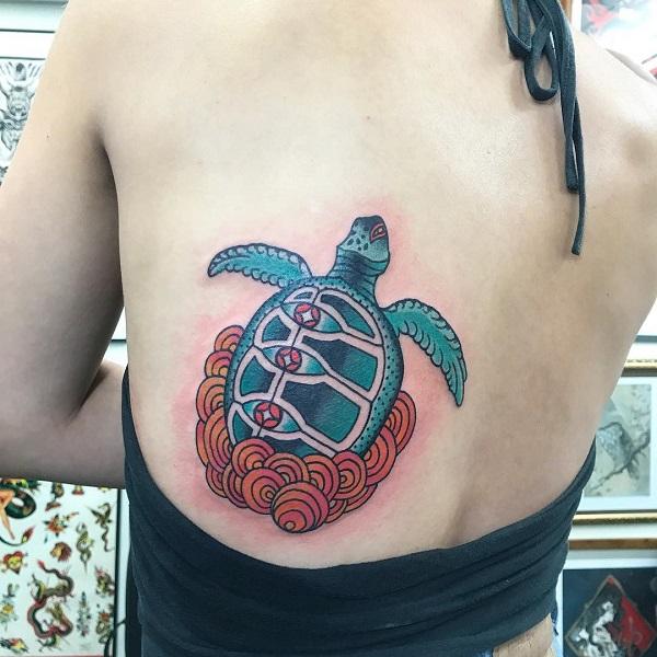 Stylized turtle and water tattoo