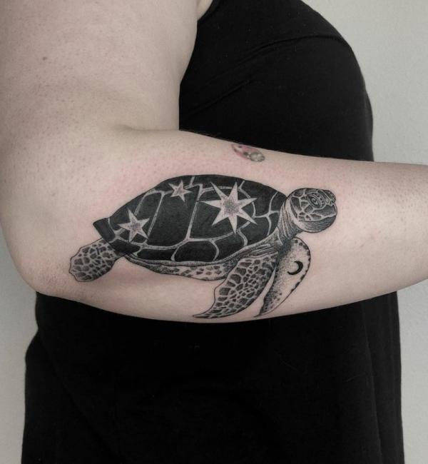 Black and white turtle with stars tattoo