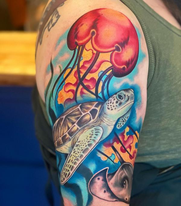 Colorful sea turtle and Jellyfish half sleeve tattoo