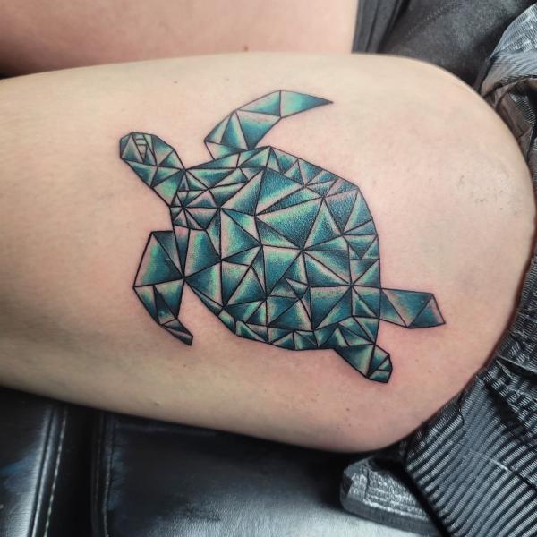 Geometric turtle thigh tattoo